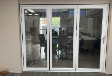 white-frame-folding-glass-door