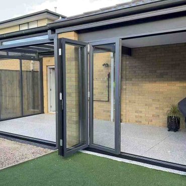 Modern backyard with sliding glass doors