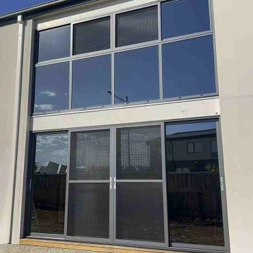 Modern house with large screened sliding doors