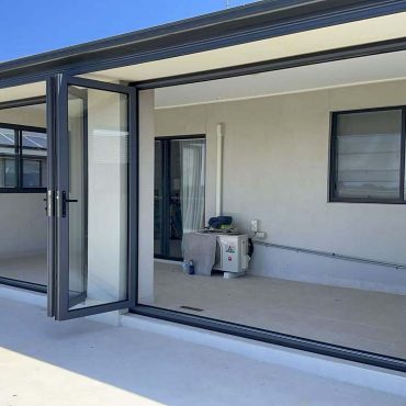 Modern outdoor room with large sliding doors